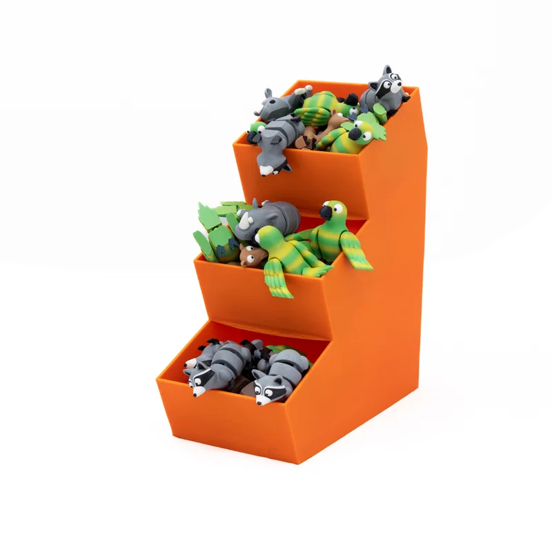 Orange three-tier Mini Critter counter display, stocked with articulated animals